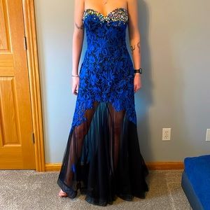 One of a kind dress.  Hand beading and flowers on bottom